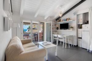 a living room with a couch and a table at La terrazza di via Daneri 2 in Bonassola