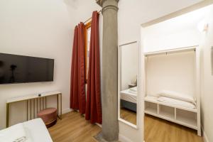 A bed or beds in a room at Residenza d'Epoca Galleria dell'Accademia