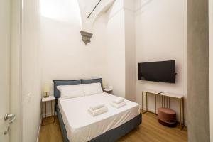 A bed or beds in a room at Residenza d'Epoca Galleria dell'Accademia