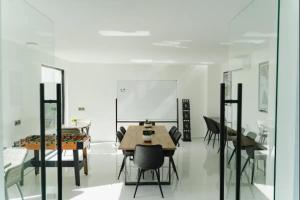 a dining room with a table and chairs at Deluxe apartments Canggu area with gym coworking security parking and full services in Tumbak Bayuh