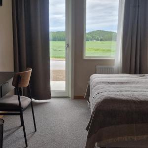Postel nebo postele na pokoji v ubytování Nordby Hotell