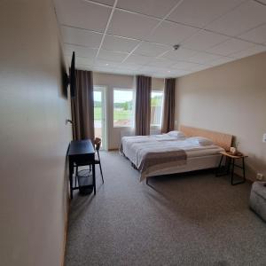 Postel nebo postele na pokoji v ubytování Nordby Hotell