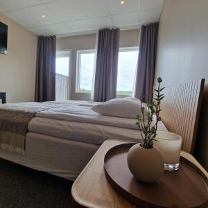 Postel nebo postele na pokoji v ubytování Nordby Hotell