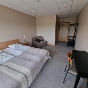 Postel nebo postele na pokoji v ubytování Nordby Hotell