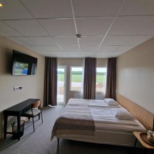 Postel nebo postele na pokoji v ubytování Nordby Hotell
