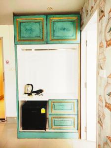 Η κουζίνα ή μικρή κουζίνα στο Mitr Inn Nimman 12 +31 φωτογραφίες