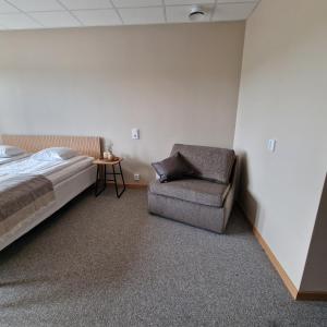 Postel nebo postele na pokoji v ubytování Nordby Hotell