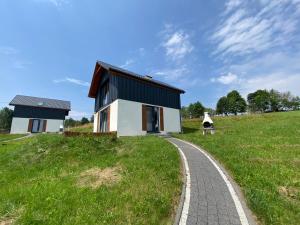 a house on a hill with a road at Domki Blisko Nieba I in Wisła +13 photos