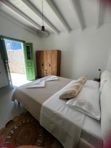 Ένα ή περισσότερα κρεβάτια σε δωμάτιο στο Villa Elli
