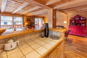 a kitchen with a counter top in a room at Saulire 6 in Mussillon +7 photos