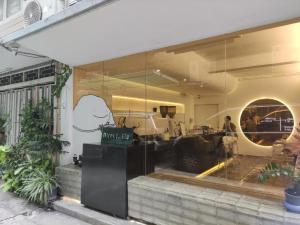 a window of a store with a monkey on it at Bangkok Dreamcatcher hostel in Bangkok