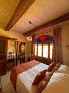 Postel nebo postele na pokoji v ubytování Maria's B&B