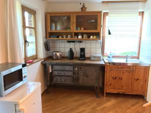 a kitchen with a sink and a counter top at Destination 23 - gut ankommen! in Meerbusch