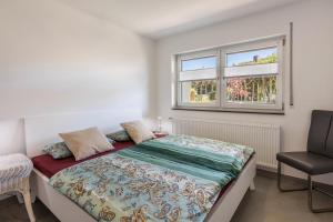 Katil atau katil-katil dalam bilik di Ferienwohnung am Bregenberg