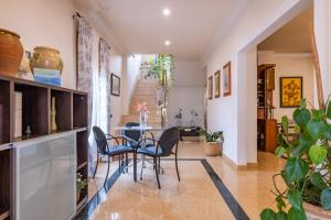 a dining room with a table and chairs at Familiar House with Private Pool and Mountains View in Venta Baja +21 photos