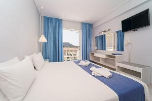 Voodi või voodid majutusasutuse Filoxenia Hotel Zakynthos toas
