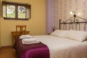 Postel nebo postele na pokoji v ubytování Hotel Rural Somiedo