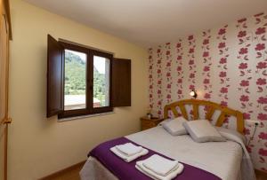 Postel nebo postele na pokoji v ubytování Hotel Rural Somiedo