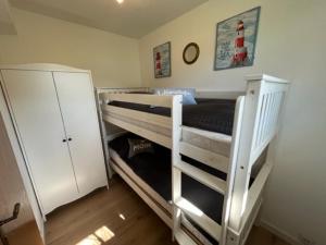 Postel nebo postele na pokoji v ubytování FeWo Meer-Kur