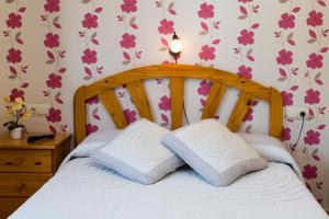 Postel nebo postele na pokoji v ubytování Hotel Rural Somiedo