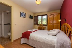 Postel nebo postele na pokoji v ubytování Hotel Rural Somiedo