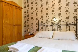 Postel nebo postele na pokoji v ubytování Hotel Rural Somiedo
