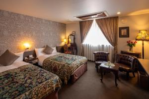 Postel nebo postele na pokoji v ubytování Hotel Berlinetta Karuizawa