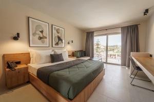 Voodi või voodid majutusasutuse Filoxenia Hotel Zakynthos toas