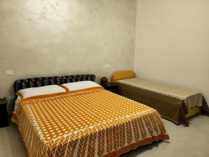 Ένα ή περισσότερα κρεβάτια σε δωμάτιο στο Casa l'Apuccia