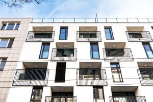 an apartment building with windows and balconies at Mickiewiczova apartment free parking by Veronika & Jano in Bratislava