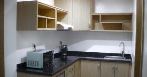 A cozinha ou kitchenette de Appart-Hotêl Résidence TITANIC