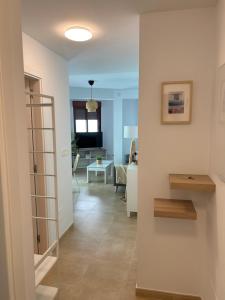 a living room with a staircase and a living room at Ondas do Mar Boutique Stays - Portonovo 1 in Portonovo