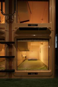an inside view of a room with a bed inside at Booth Netcafe & Capsule in Tokyo