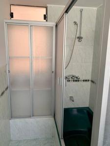 a shower with a glass door in a bathroom at Yanahuara La Casa del Angel in Yanahuara