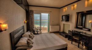 Postel nebo postele na pokoji v ubytování Beau Site Hotel