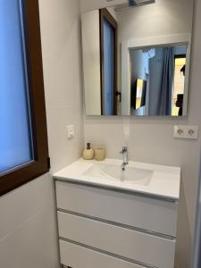 a bathroom with a sink and a mirror at Suspiro 202 Elegant Suite in Granada