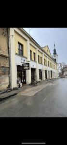 a building with a sign on the side of a street at jack hostel in Sremski Karlovci
