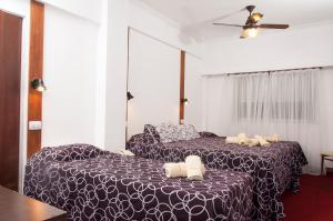 En eller flere senge i et værelse på Hotel Savoia + 51 billeder