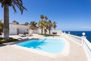 a swimming pool with a view of the ocean at Atlantic Dream with pool II in Puerto de Santiago