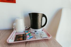 a coffee pot sitting on top of a tray at Hostal La Toba in Cañete