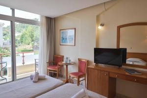 TV a/nebo společenská místnost v ubytování Neda Hotel