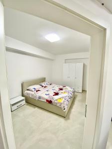 Postel nebo postele na pokoji v ubytování Eda Apartment