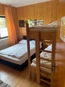 Postel nebo postele na pokoji v ubytování Berg & Skihütte -Schmittenhof + 16 fotografií