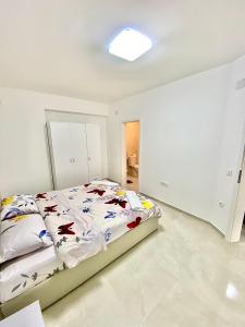 Postel nebo postele na pokoji v ubytování Eda Apartment