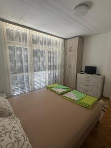 Postel nebo postele na pokoji v ubytování Andjela’s Apartment