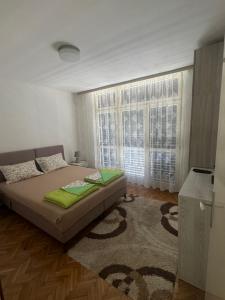 Postel nebo postele na pokoji v ubytování Andjela’s Apartment