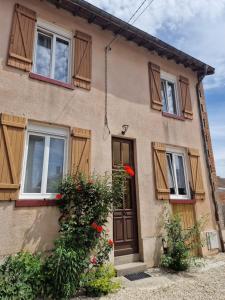 a house with flowers in front of it at Mirabelka in Revigny-sur-Ornain