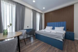 Ένα ή περισσότερα κρεβάτια σε δωμάτιο στο M&N Hotel