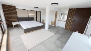 Postel nebo postele na pokoji v ubytování Sky apartment