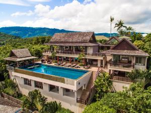 an aerial view of a house with a swimming pool at Baan Grand Vista - Panoramic Sea View 5 Bed Pool Villa in Bophut